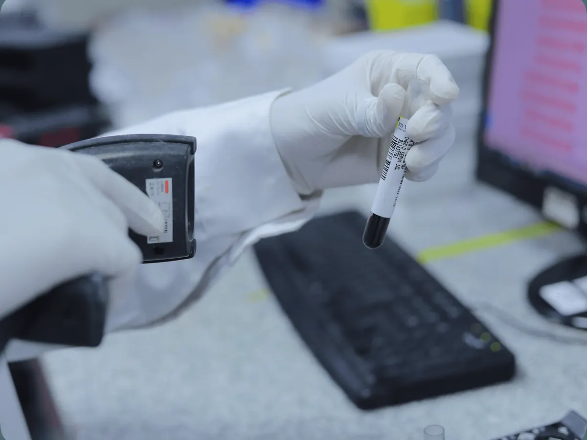 A sample tube being logged at an Agilus Diagnostics lab
